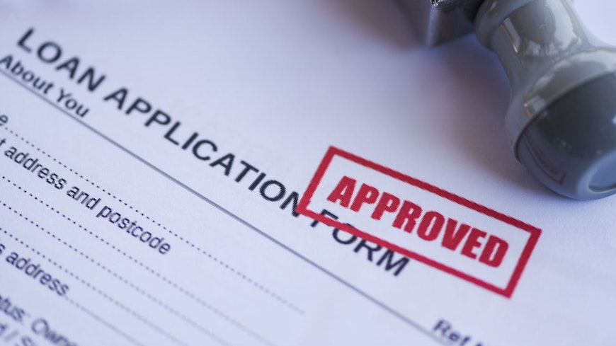 Image of loan documents being approved
