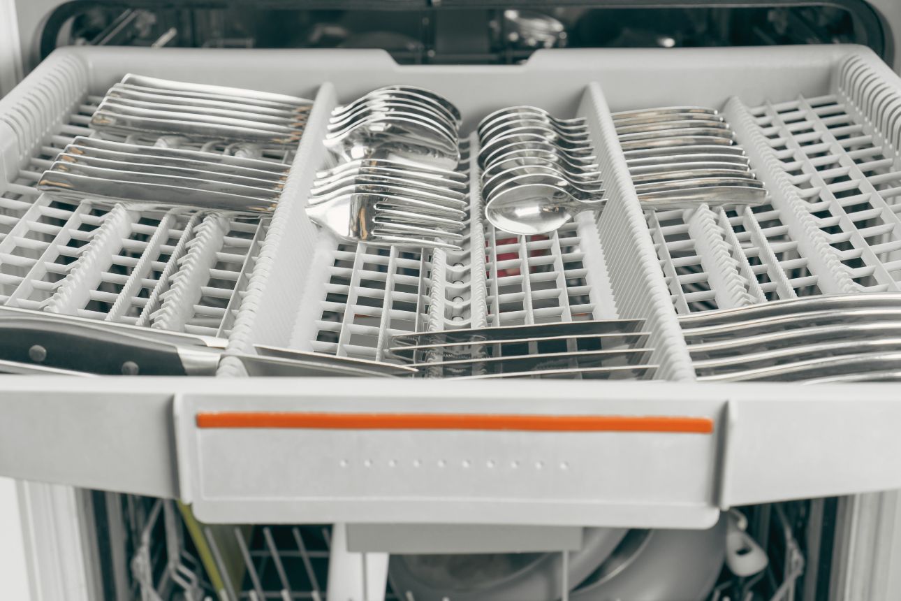 Image of a cutlery tray from a dishwasher
