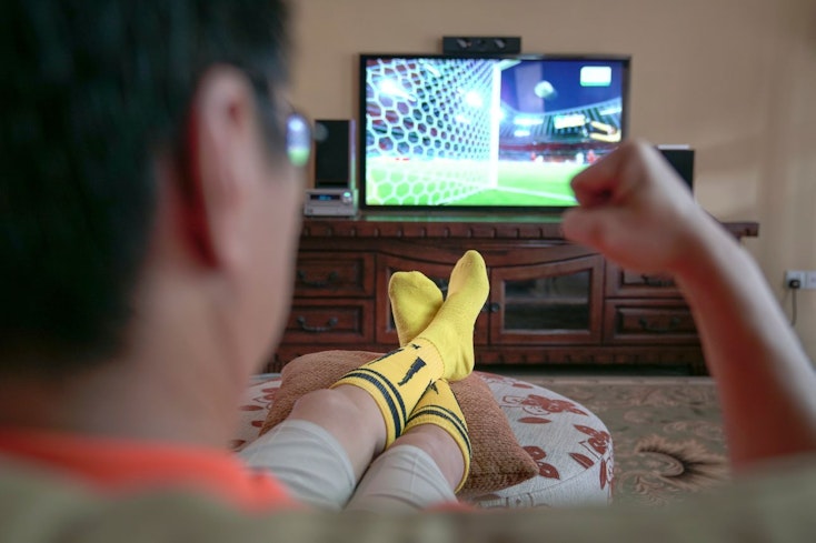 Image of a guy watching sport
