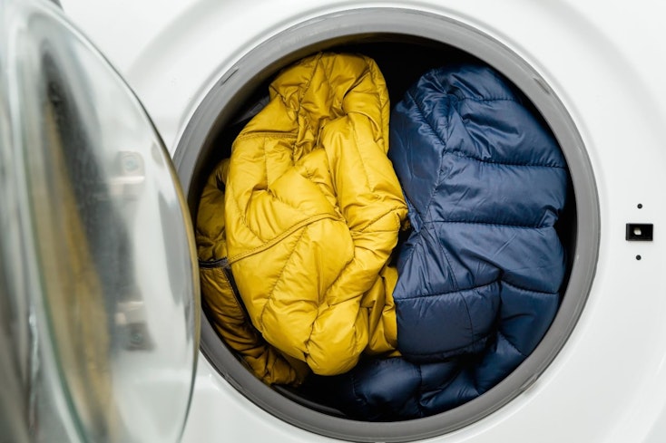 Image of puffer jackets in the washing machine