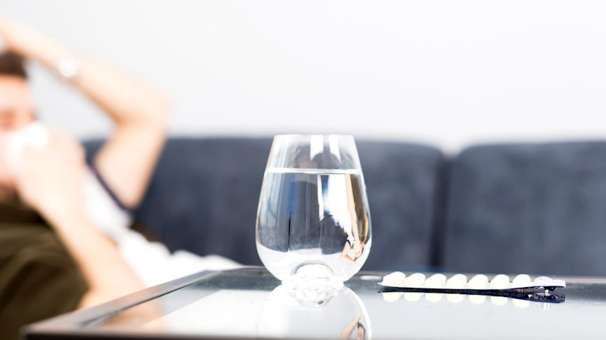 Image of water and antihistamine pills