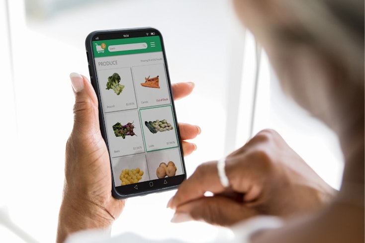 Image of woman shopping online for groceries