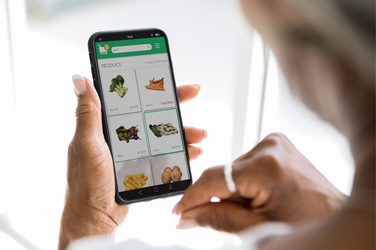 Image of woman shopping online for groceries