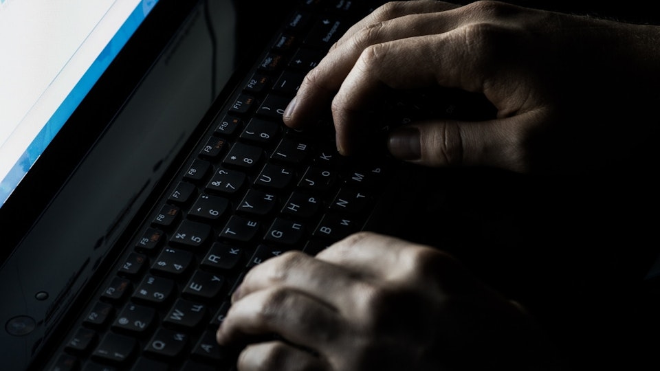 Image of hands typing on a keyboard