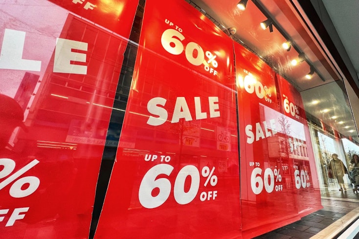 Sale signs on storefront