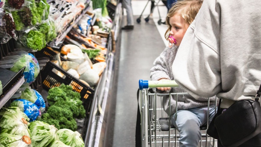 Image of a woman with her baby at the supermarket