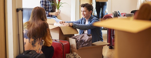 Group of young flatmates moving in.