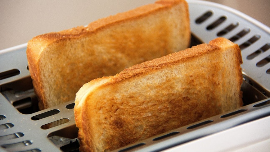Image of bread popping out of a toaster