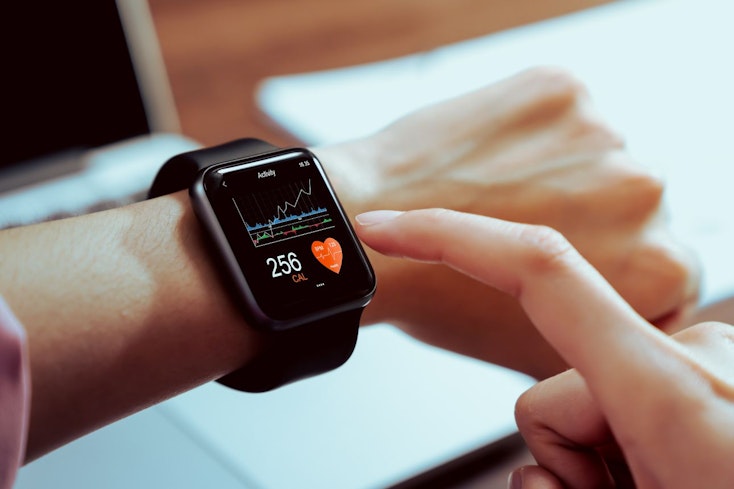 Image of a woman wearing a fitness tracker