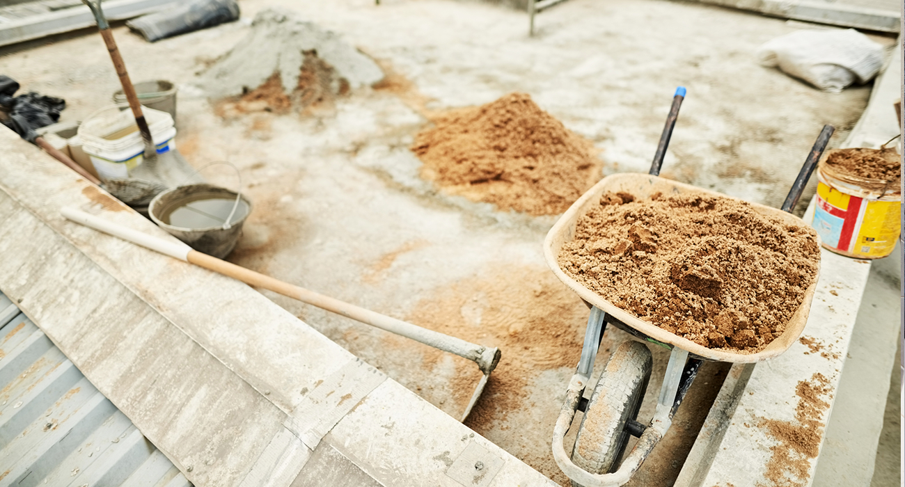 Shot of construction material with tools at a building site.