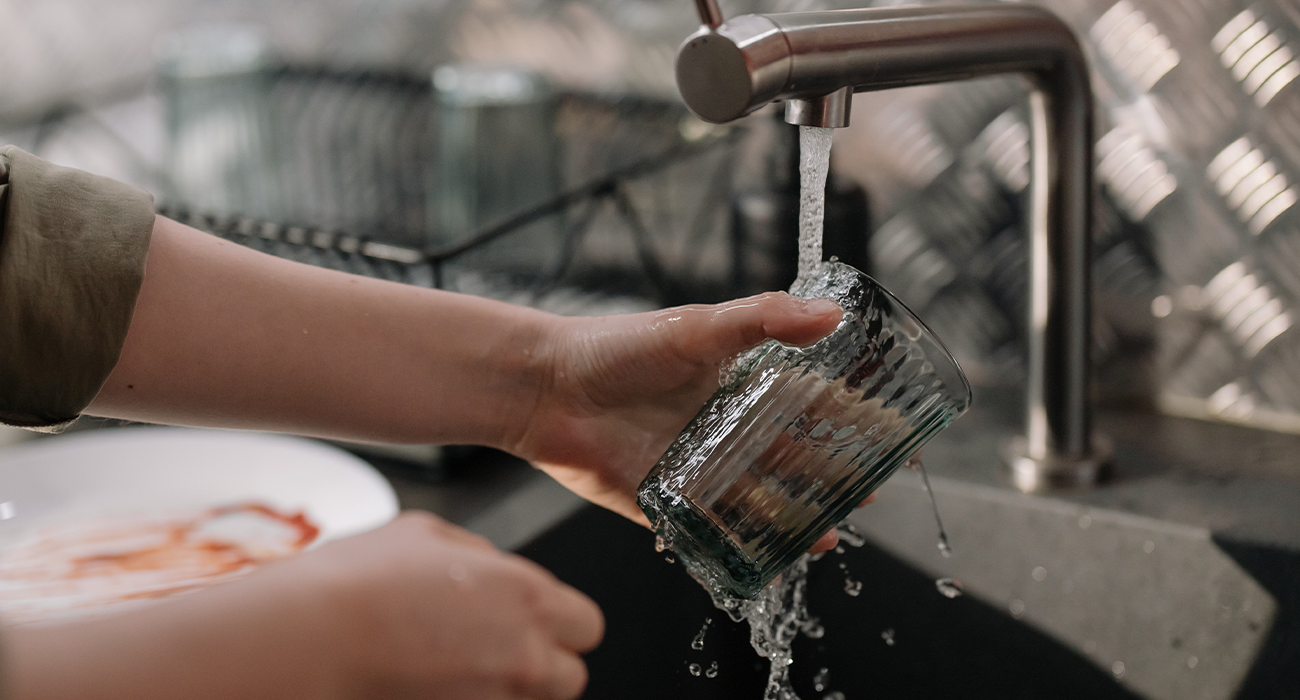Person doing the dishes by hand.