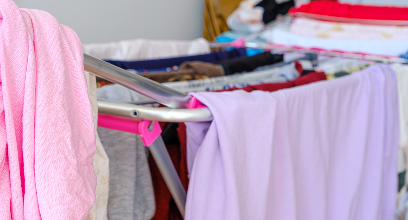 Clothes drying on rack indoors.
