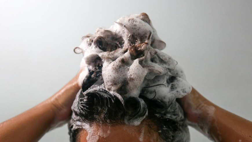 Image of a woman washing her hair