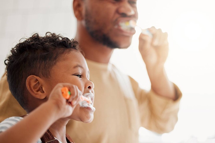 Image of a toddler brushing his teeth