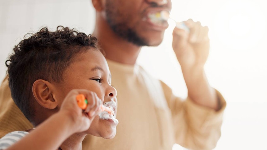 Image of a toddler brushing his teeth