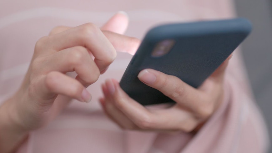 Image of woman using her phone