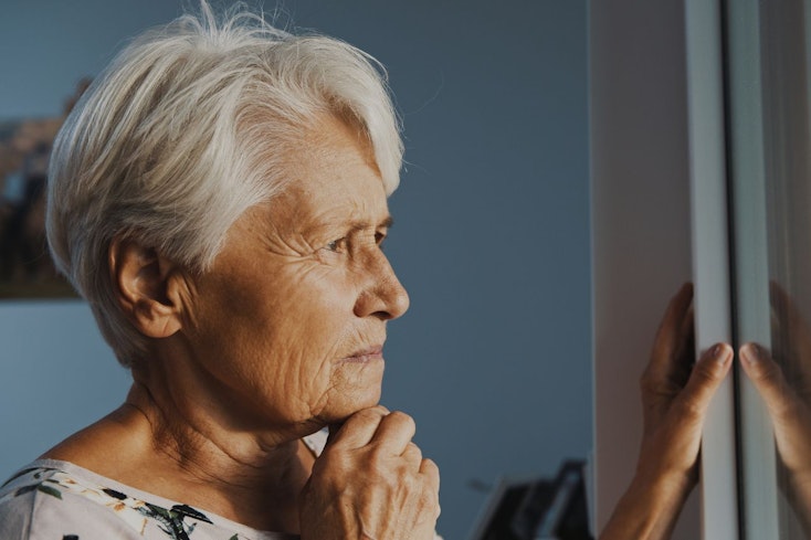 Image of a woman looking out the window