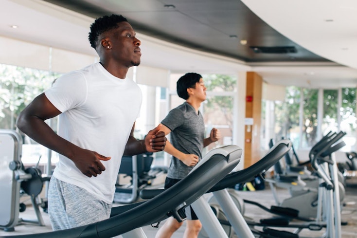 Image of men running on a treadmill