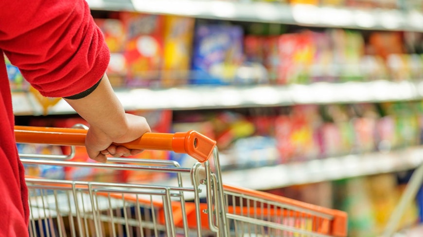 Image of a person with a grocery cart
