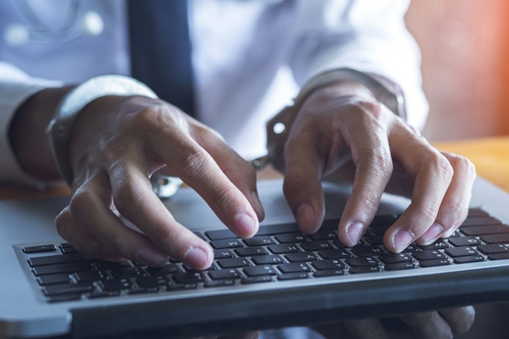 Image of a man with handcuffs on