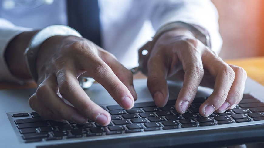 Image of a man with handcuffs on