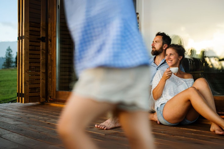 Family sitting outside the house