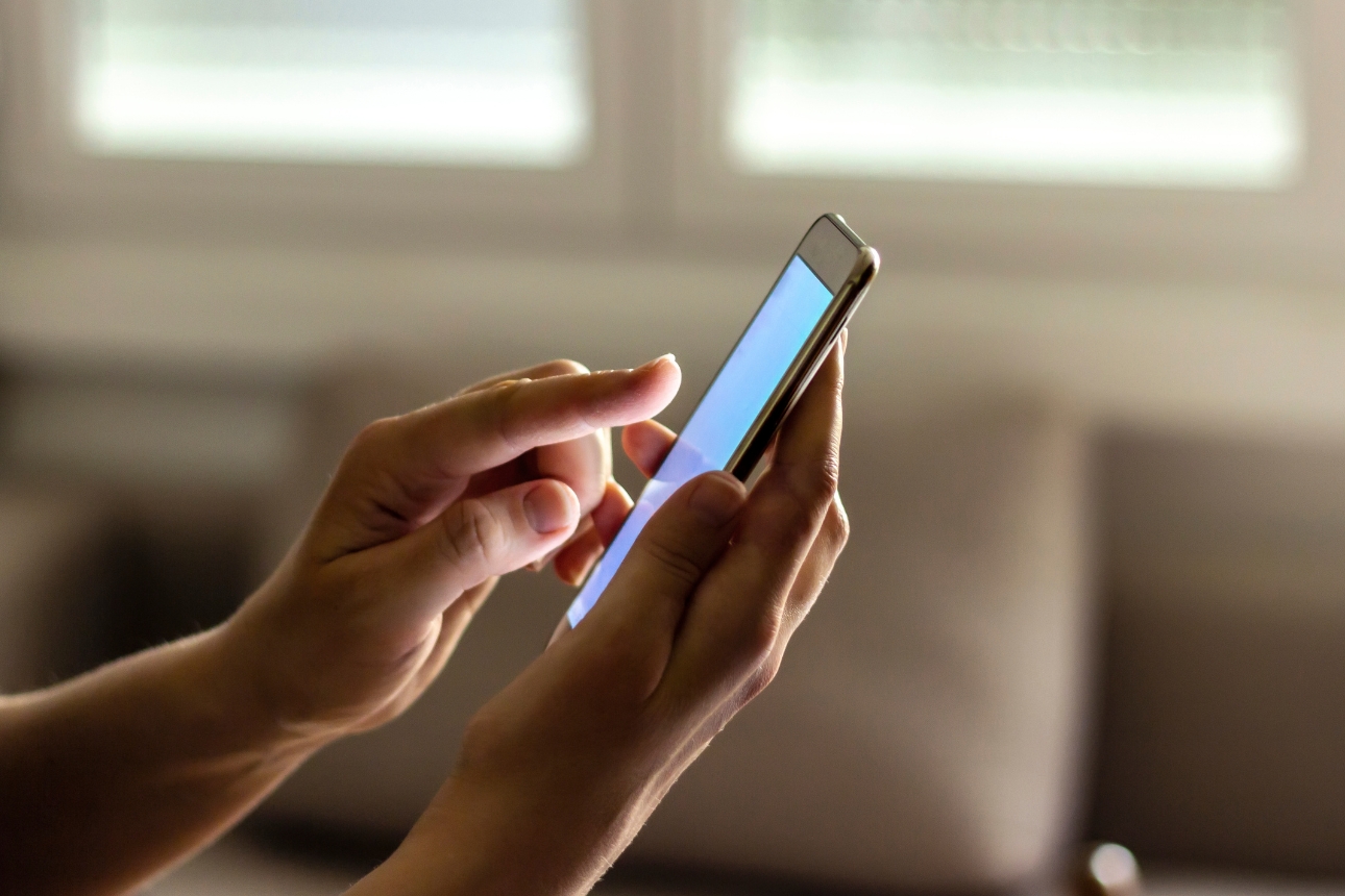 Person using mobile phone.