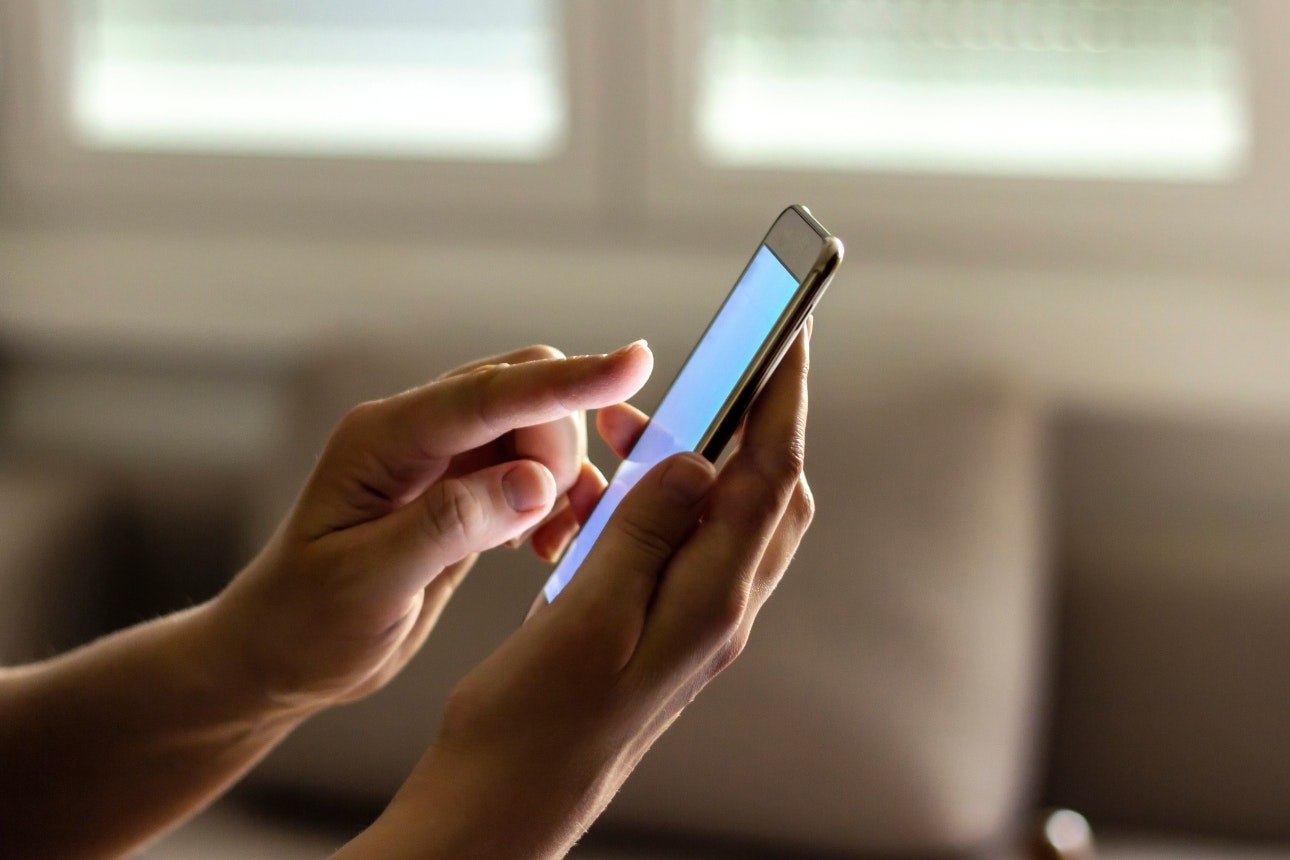 Person using mobile phone.