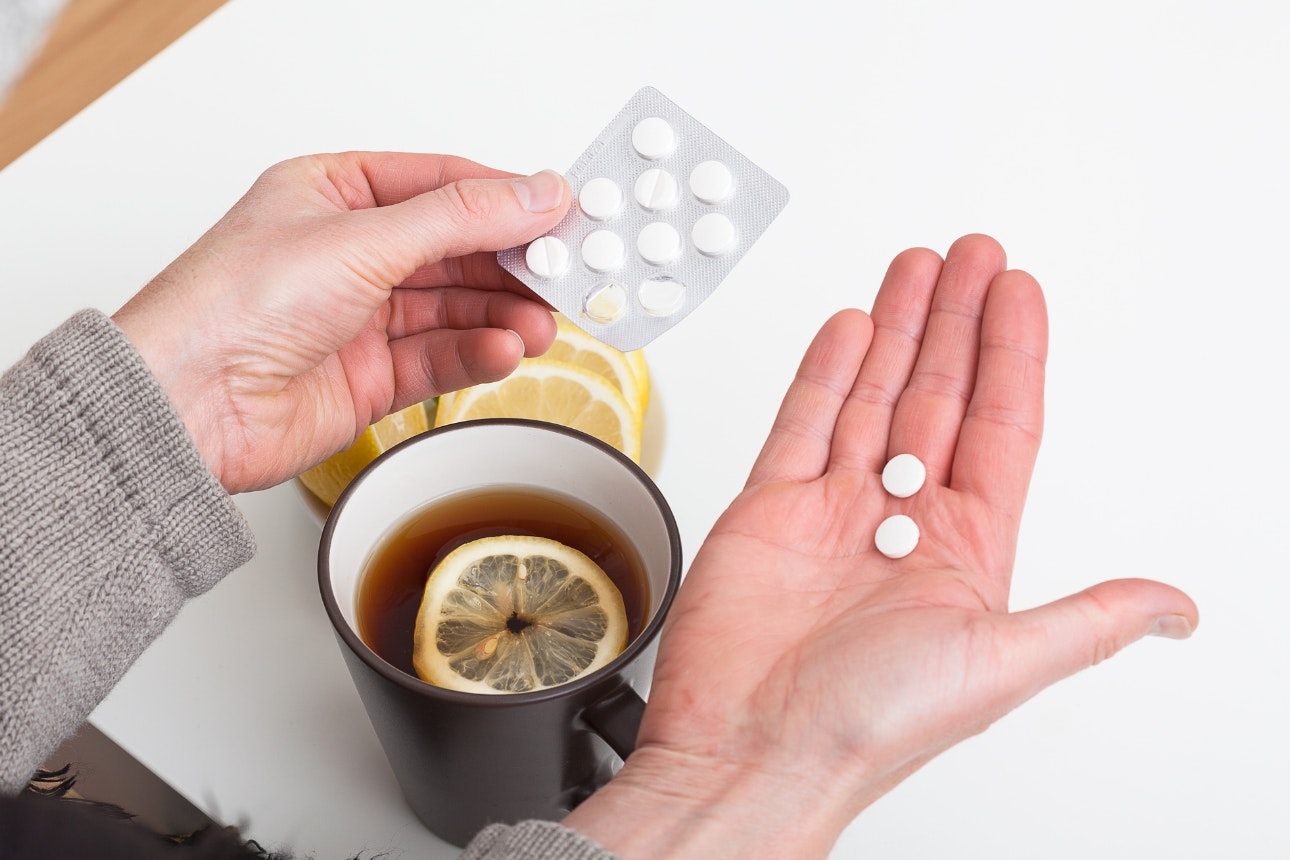 Cold medicine with lemon tea.