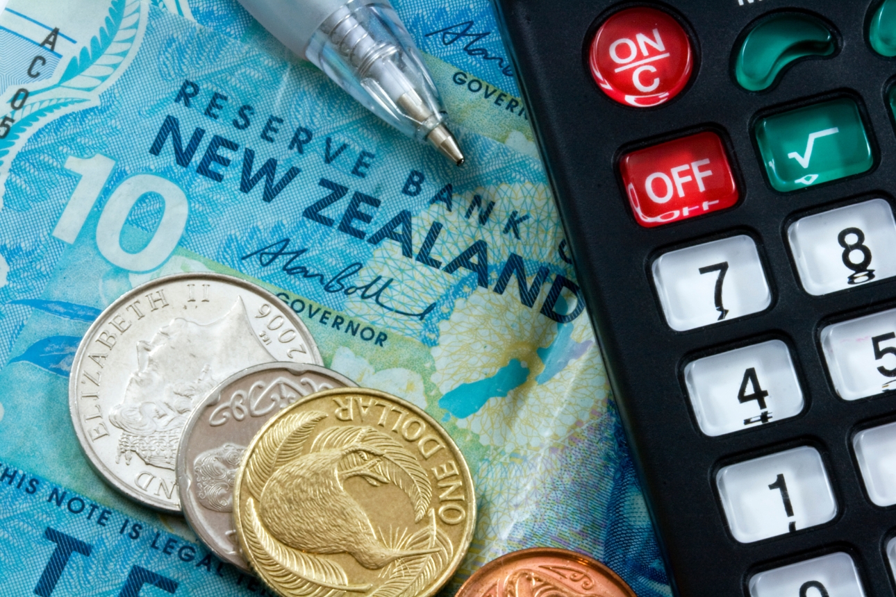 New Zealand money and a calculator.