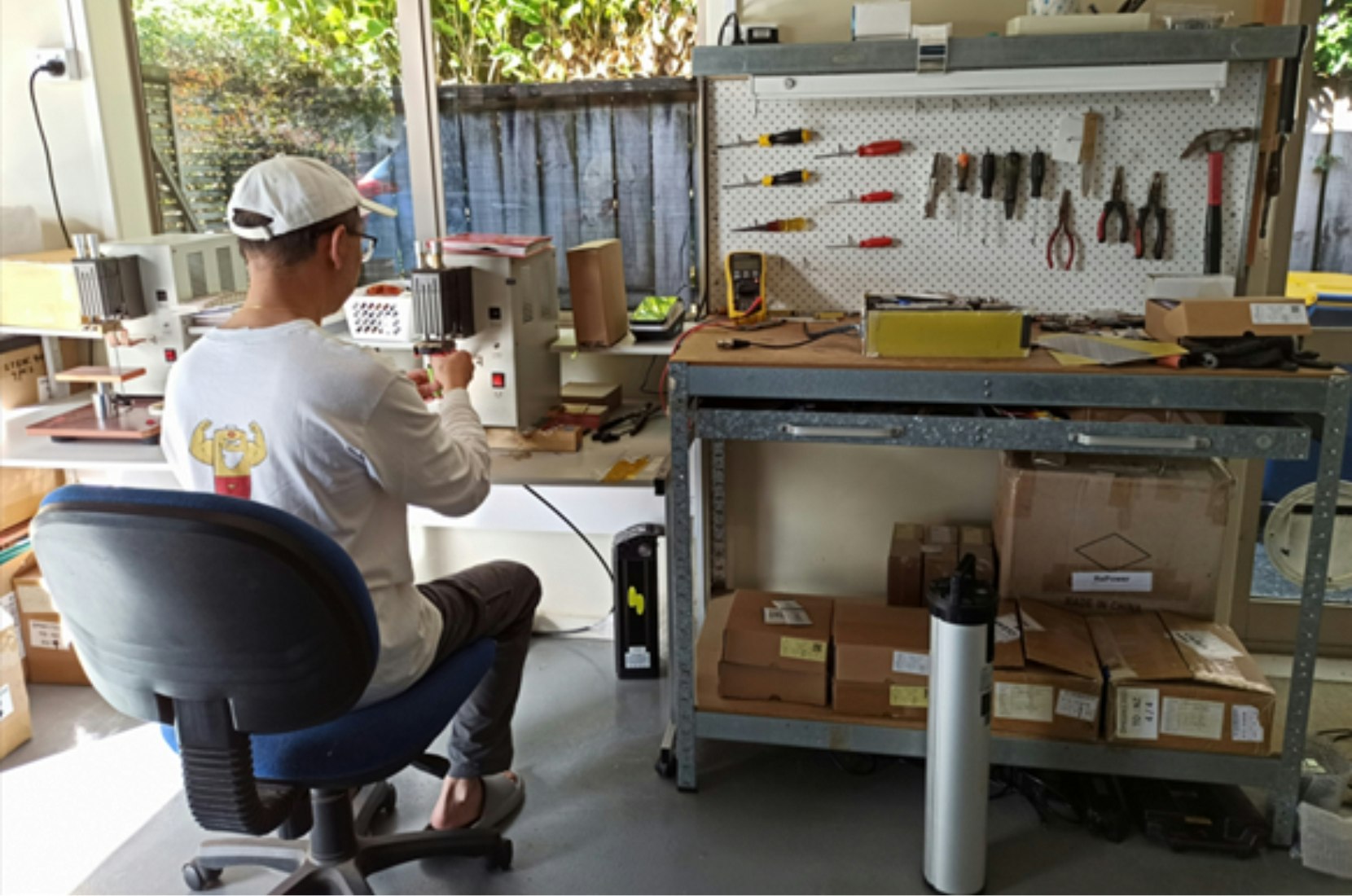 Repacking batteries in a workshop.