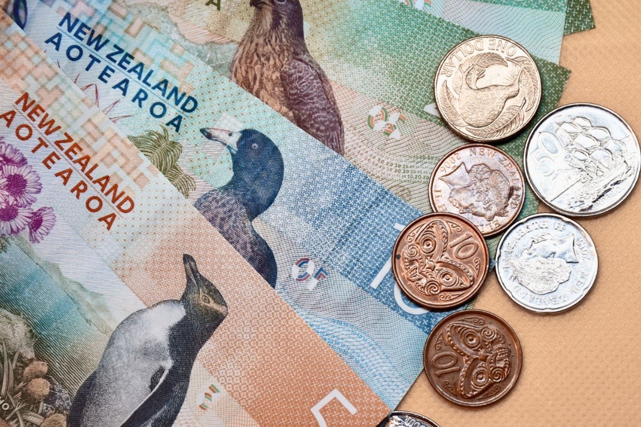 Red money sign on black background.