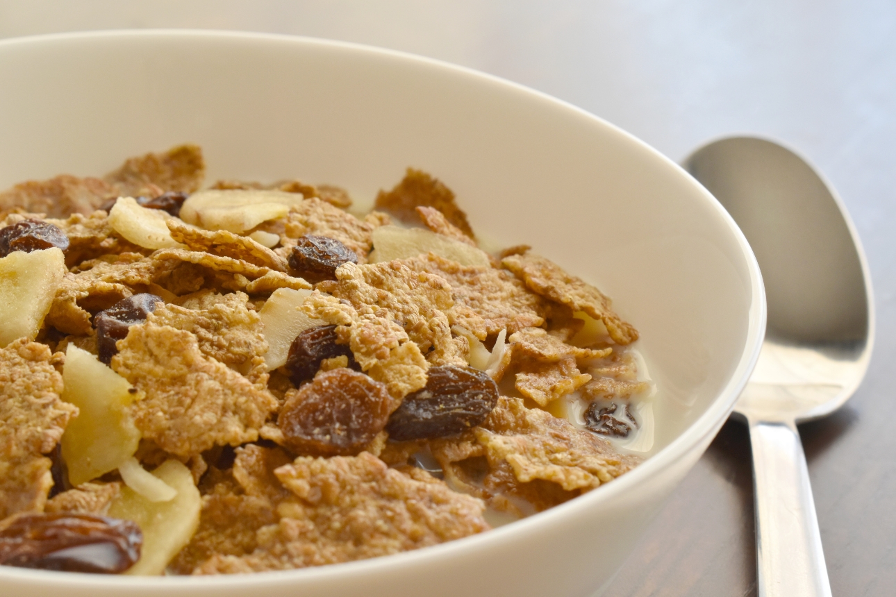 Bowl of cereal and a spoon.