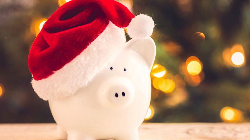 Piggy bank wearing Santa hat.