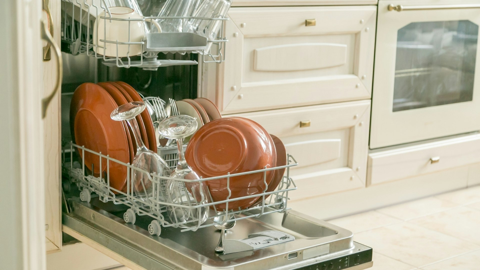Dishwasher with dishes stacked inside.